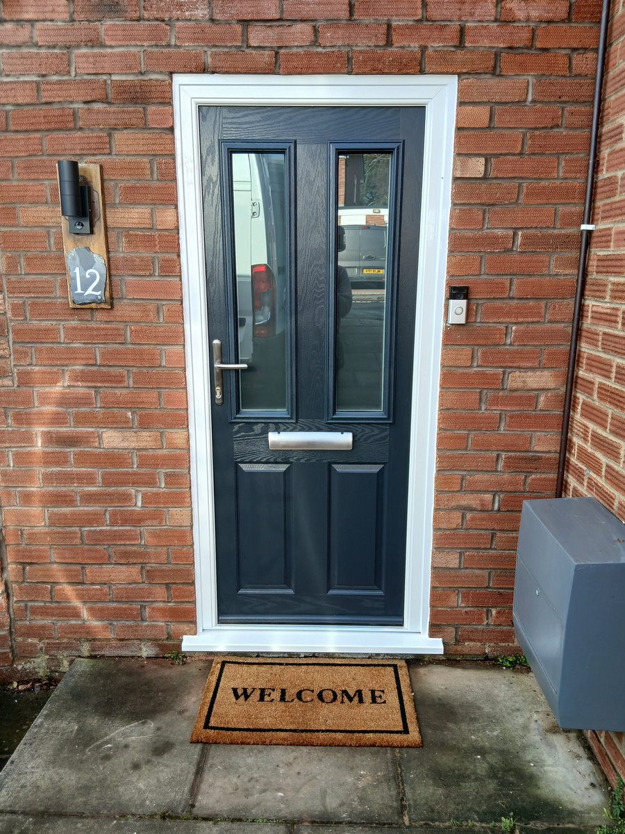 Dark front door with white frame