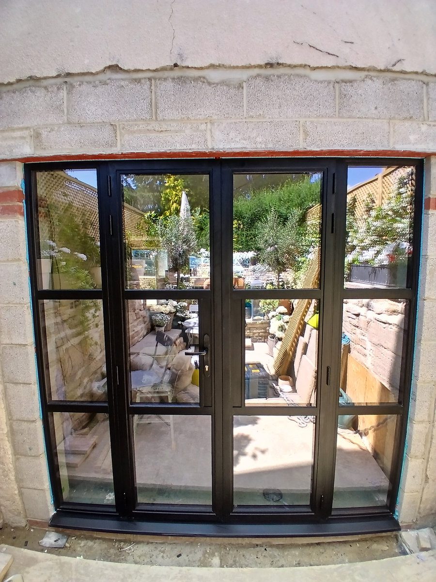 Black aluminium grid-style doors
