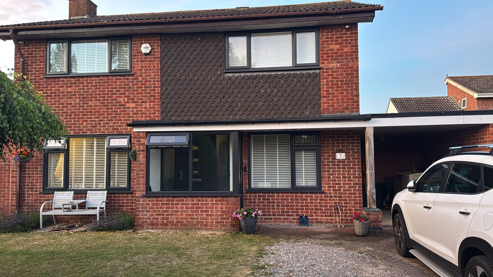 Brick house with new anthracite grey windows